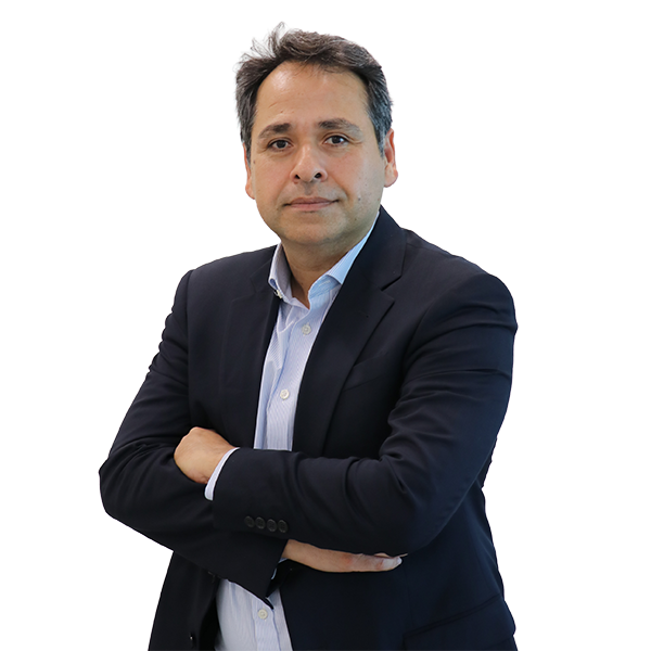 Professional man in a navy blazer and light shirt, arms crossed, looking at the camera for a corporate headshot.