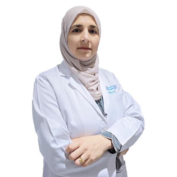 Female medical professional wearing a beige hijab and white lab coat with a stethoscope, arms crossed.